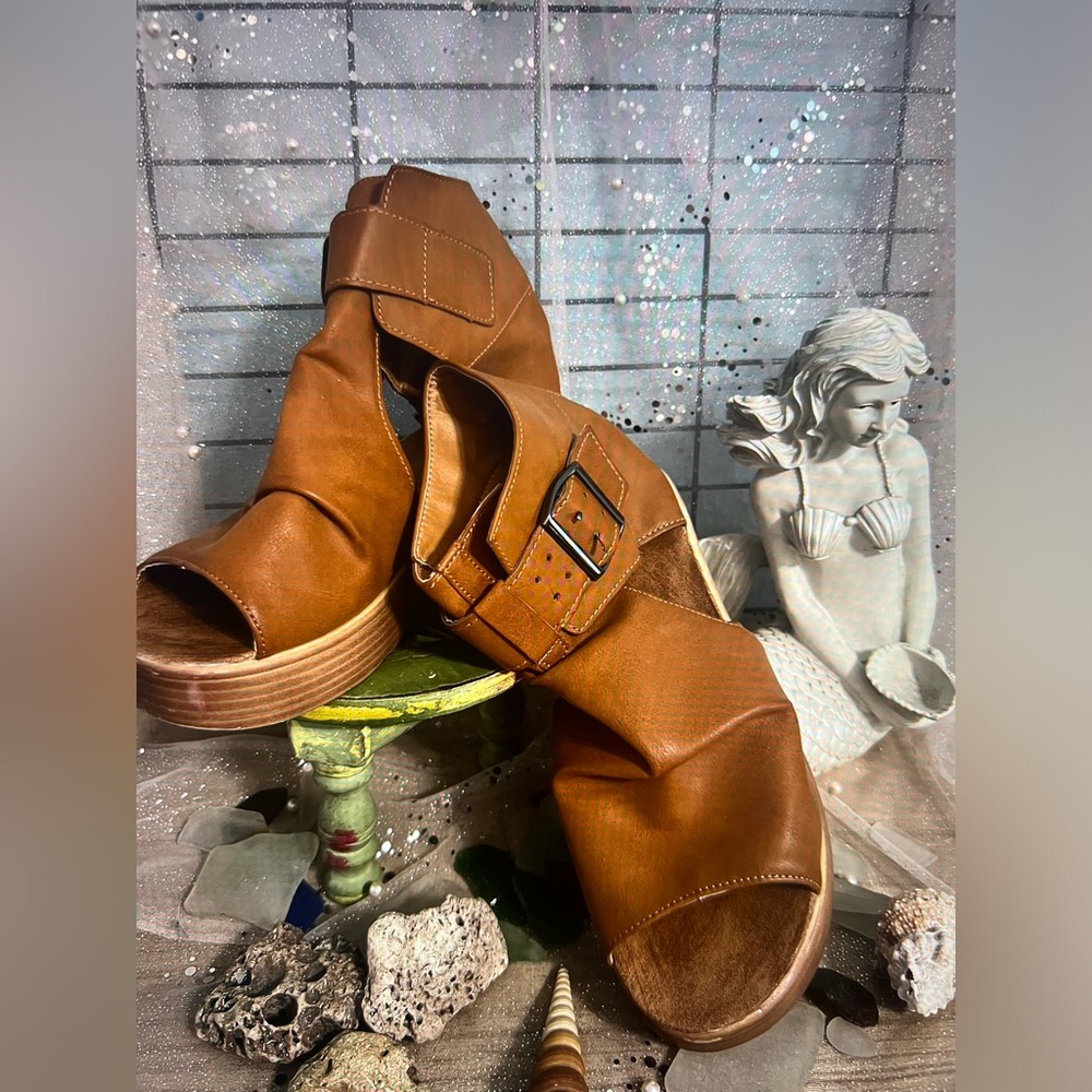 A pair of brown platform sandals
